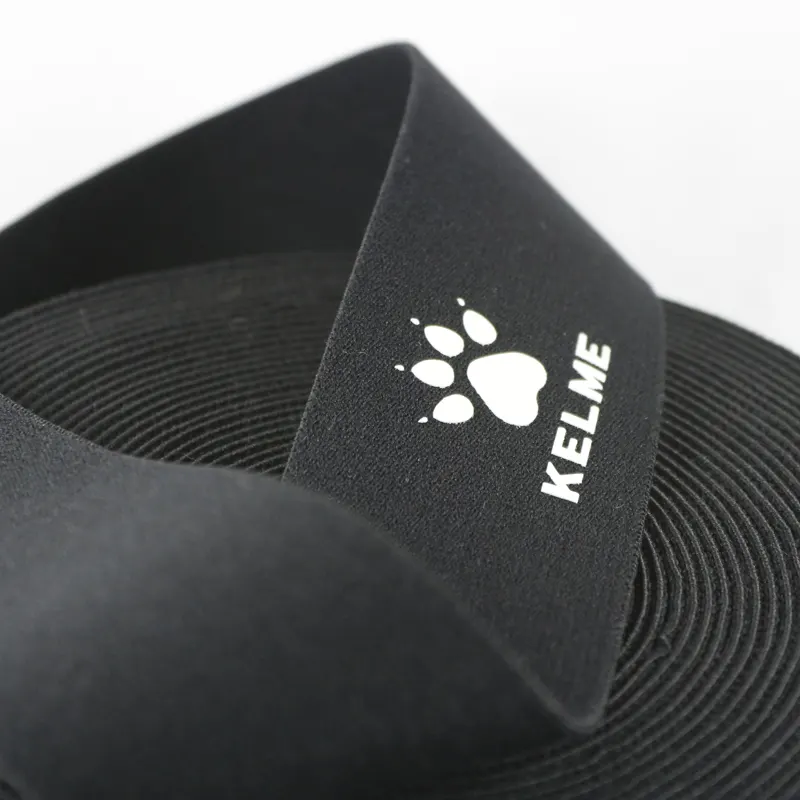 Luminous printed ribbed elastic band shown in a coiled roll for bulk supply