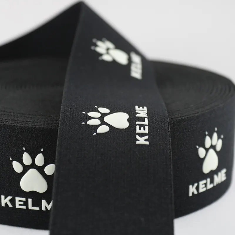 Luminous printed ribbed elastic band stretched to demonstrate flexibility