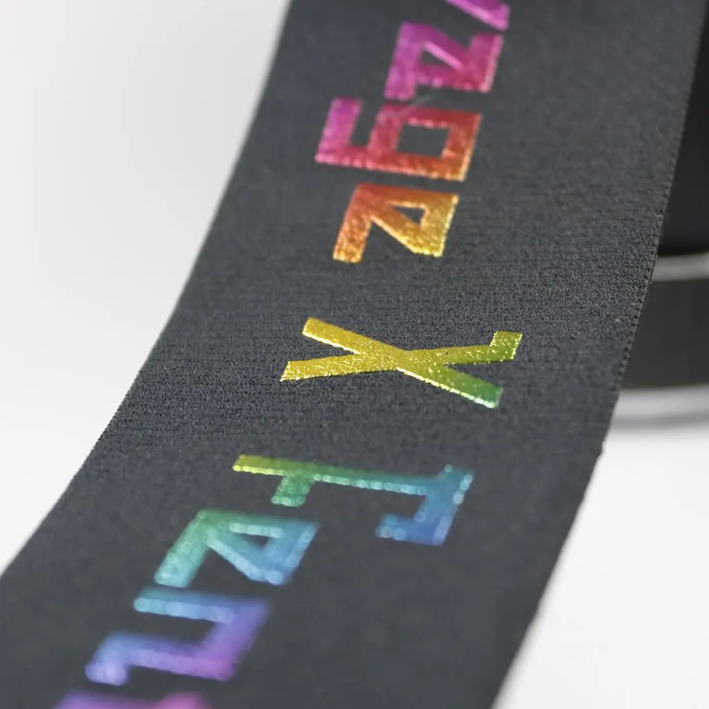 Elastic band roll displaying multicolor print across the surface
