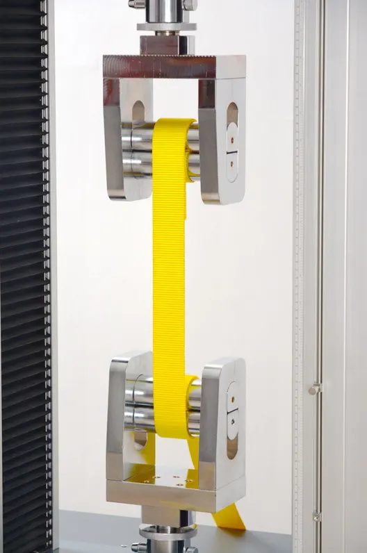 Tensile testing machine running a webbing strength test in our in-house lab