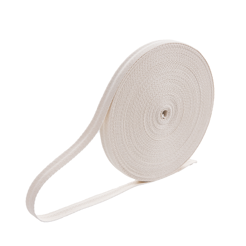 Full roll of natural cotton herringbone webbing showing the woven herringbone texture