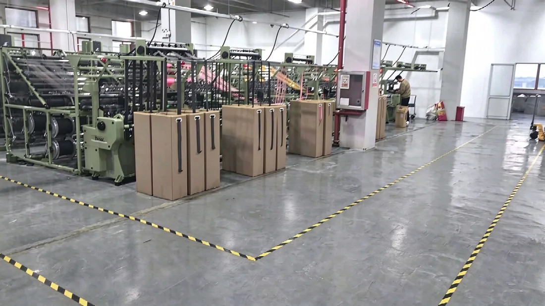 Crochet knitting machines producing elastic webbing at the Zivay Webbing plant in Jiangsu
