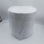 White ton bag leak-proof sealing strip coiled in a roll and wrapped in clear plastic film, shown on a plain light background