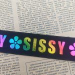 Laser printed elastic band laid on printed paper showing colour and texture