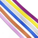 Flat woven webbing straps in purple, yellow, white, blue, orange and pink arranged diagonally on a white background